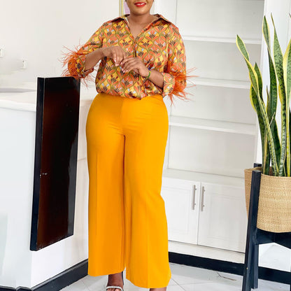 Expressive outfit for women with printed blouse and wide pants Chic and Style