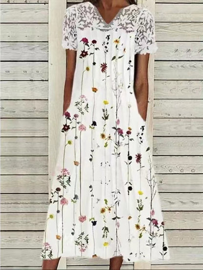 Robe maxi dames avec décolleté haut en dentelle et design floral orné de poches Chic und Stil