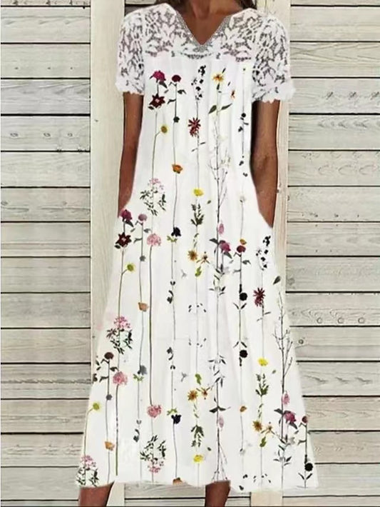Robe maxi dames avec décolleté haut en dentelle et design floral orné de poches Chic und Stil