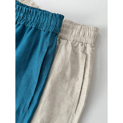 Casual linen pants for women with elastic waist and side pockets with openings.