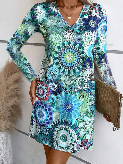 Robe blouse à col en V ludique pour femmes avec des motifs floraux et des manches longues Chic und Stil