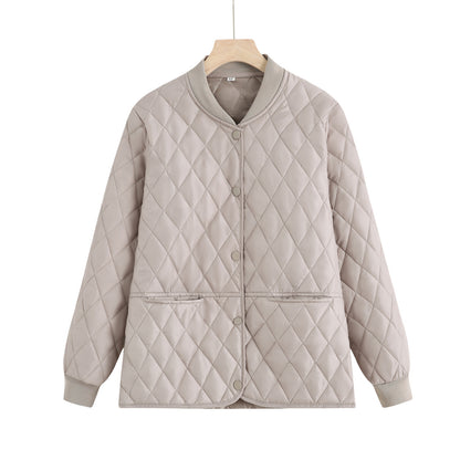 Women's quilted transition jacket with practical pockets and elastic cuffs Chic and Style