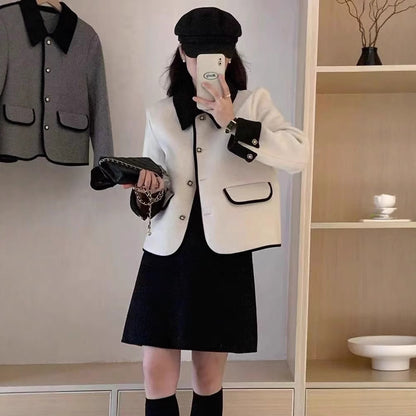 Dame élégante veste courte avec des détails contrastants Chic und Stil