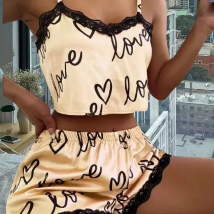 Chic and Style women's satin crop top and shorts set with hearts and lace accents