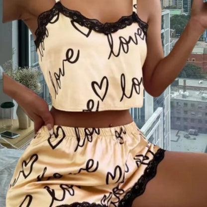 Chic and Style women's satin crop top and shorts set with hearts and lace accents