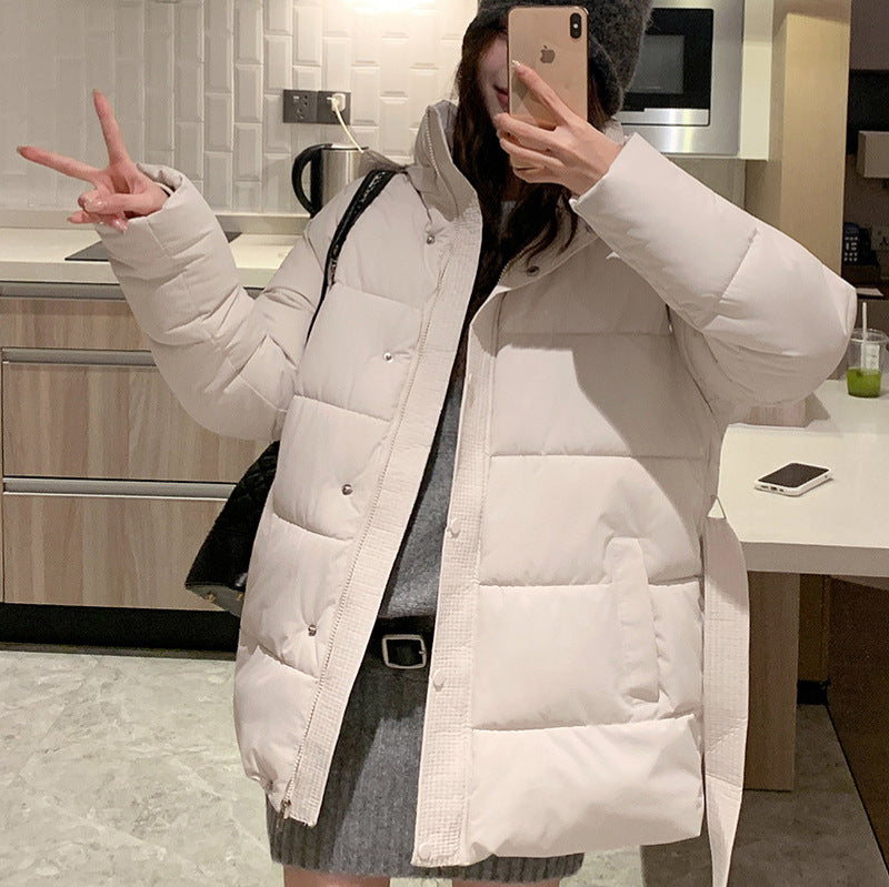 Classic women's down jacket with high collar and practical pockets. Chic and stylish.