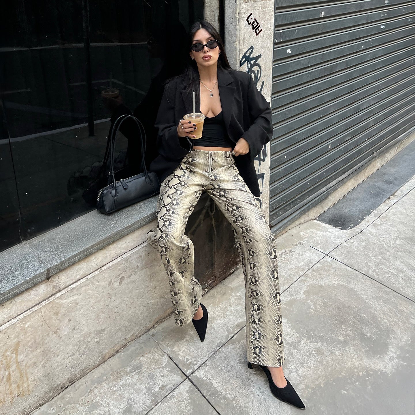 Elegant woman snake print pants Chic and Style