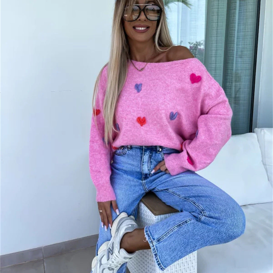 Pull femme avec des cœurs ludiques et une coupe décontractée Chic und Stil