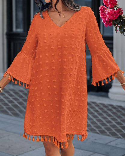 Robe de plage pour femmes avec un élégant décolleté en V et des franges décoratives Chic und Stil