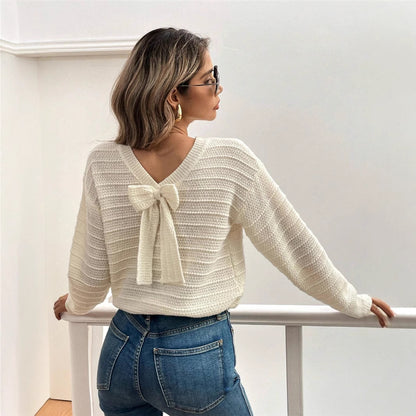 Pull femme en tricot à col en V avec élément décoratif de nœud Chic und Stil