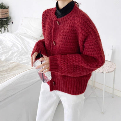 Pull en gros tricot pour femmes avec patte de boutonnage décorative et motif en nid d'abeille Chic und Stil