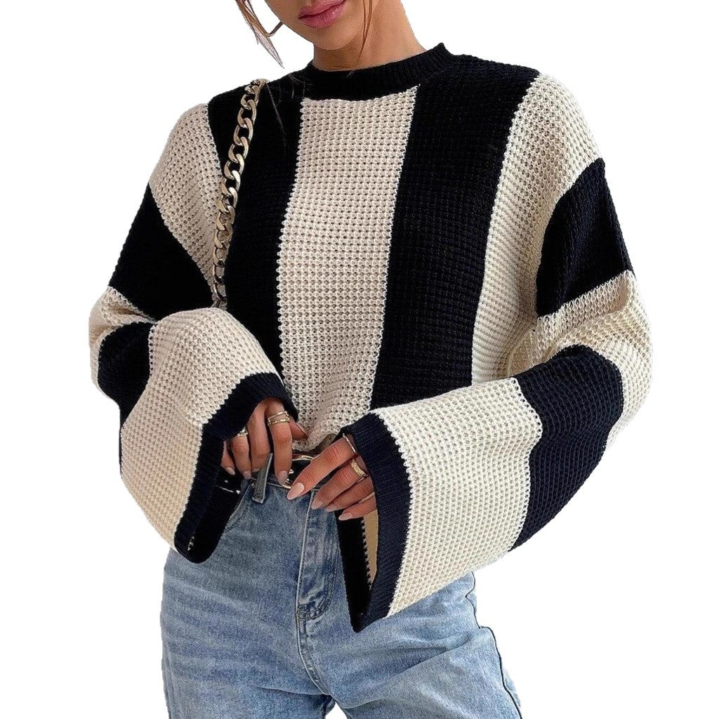 Oversized knitted sweater for ladies with a trendy striped pattern Chic and Style