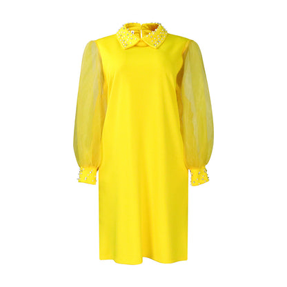 Robe pour femmes avec manches transparentes et ornements en perles Chic und Stil