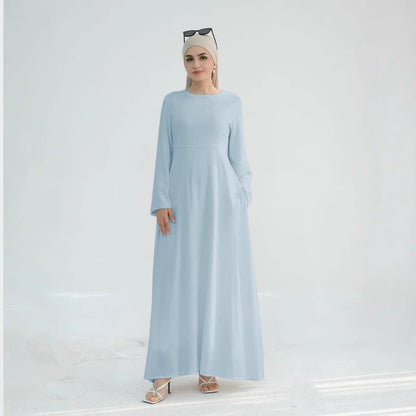 Robe maxi élégante pour dames avec des manches longues et des poches latérales Chic und Stil