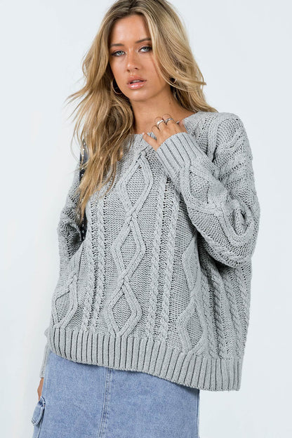 Pull femme en grosse maille avec des manches volumineuses et un motif torsadé classique Chic und Stil