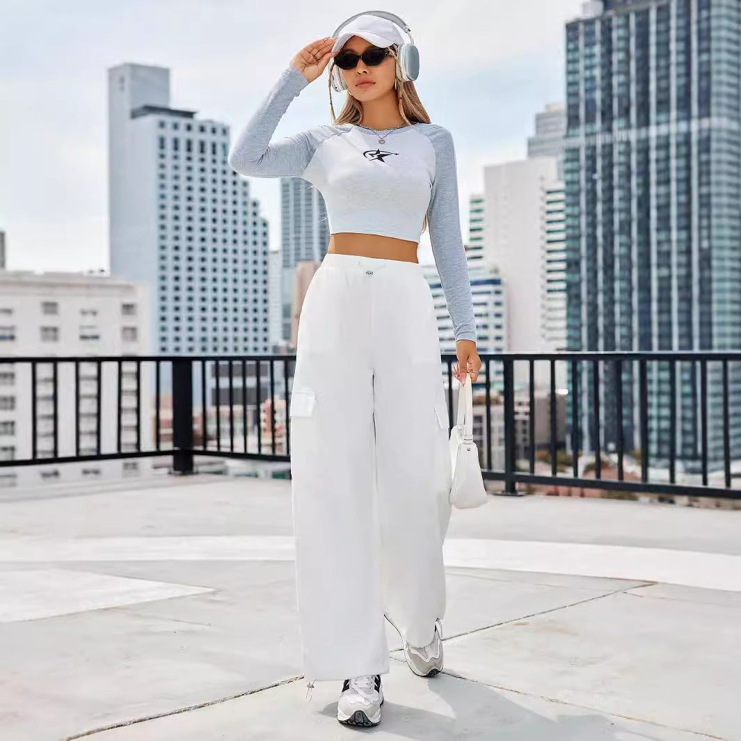 Dames Haut de crop sportif à manches longues et design graphique moderne Chic und Stil