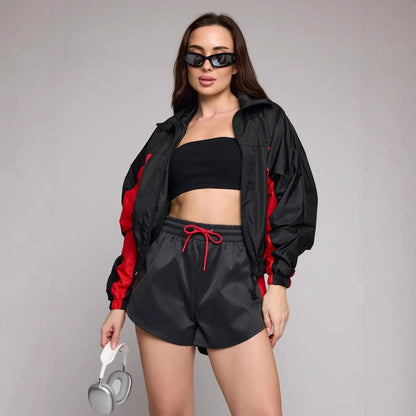 Women's athletic workout clothing with a highly functional jacket and chic stylish shorts