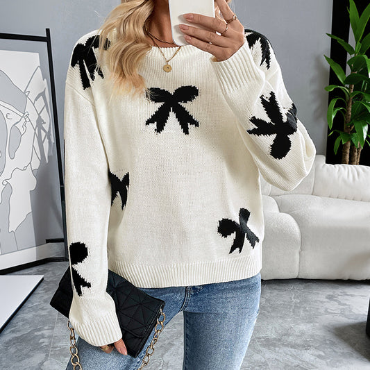 Dames Pull doux avec un motif nœud ludique Chic und Stil