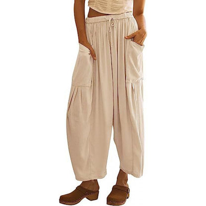 Casual harem pants for women with practical side pockets and loose fit Chic and Style