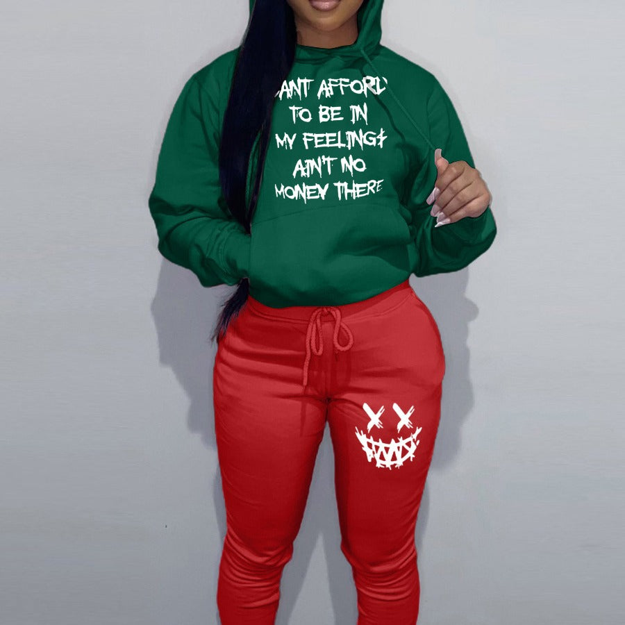 Casual women’s outfit with hoodie and jogger pants, featuring unique writing and creative patterns Chic and Style