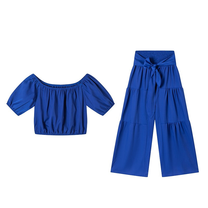 Woman Deep V-Neck Crop Top and High-Waisted Palazzo Pants Chic and Style