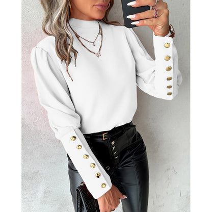 Blouse élégante pour femmes avec des manches bouffantes et des détails de boutons dorés Chic und Stil