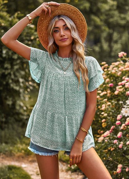 Dynamic feminine blouse with ruffle details and floral design Chic und Stil