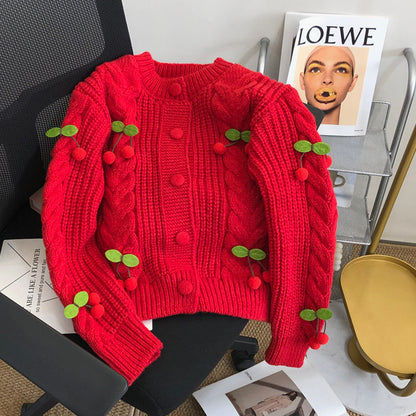 Pull en grosse maille pour femmes avec des appliqués floraux et des détails de boutons Chic und Stil