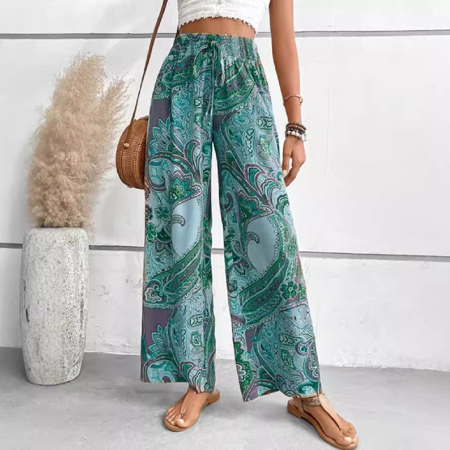Wide palazzo pants for women with a colorful paisley pattern and an elastic waistband Chic und Stil