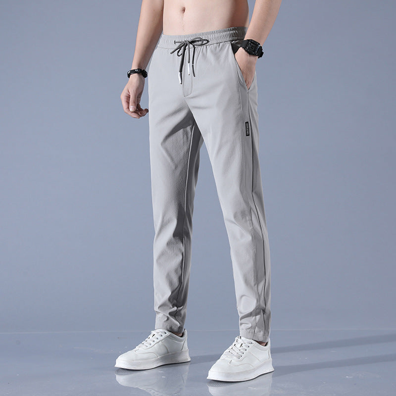 Men's sports pants with adjustable drawstring and zippered pockets on the sides Chic and Style