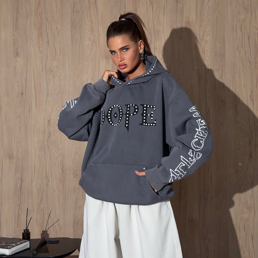 Dames hoodie oversized avec décoration de pierres frappante et impressions créatives sur les manches Chic und Stil