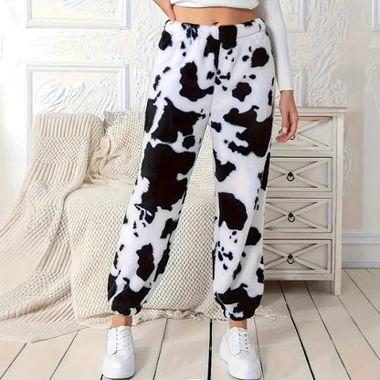 Ladies plush pants with a trendy cow spot pattern and elastic waist Chic and Style