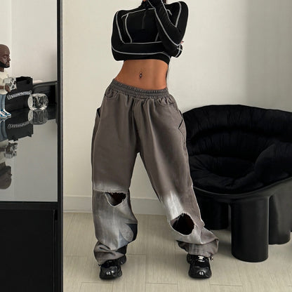 Casual women's pants with an oversized relaxed fit and trendy tear details Chic and Style