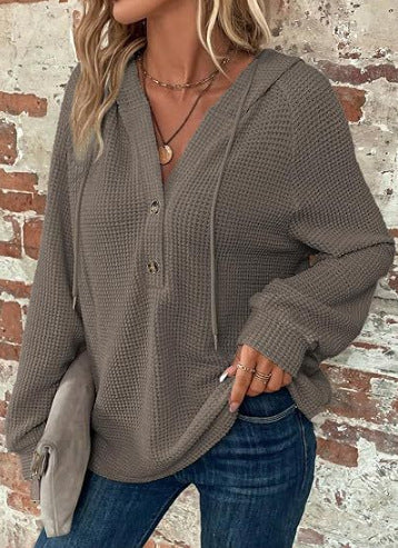 Pull à capuche décontracté pour femmes avec des détails en boutons et un tissu structuré Chic und Stil