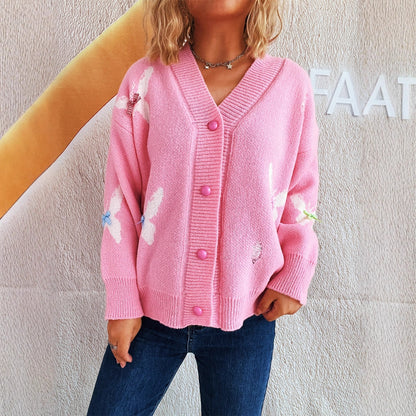 Dame cardigan avec un design de papillon ludique et fermeture à bouton Chic und Stil