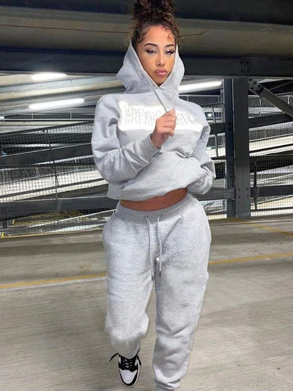 Women's sporty leisure sweatshirt set and jogging pants with a practical kangaroo pocket design Chic and Style