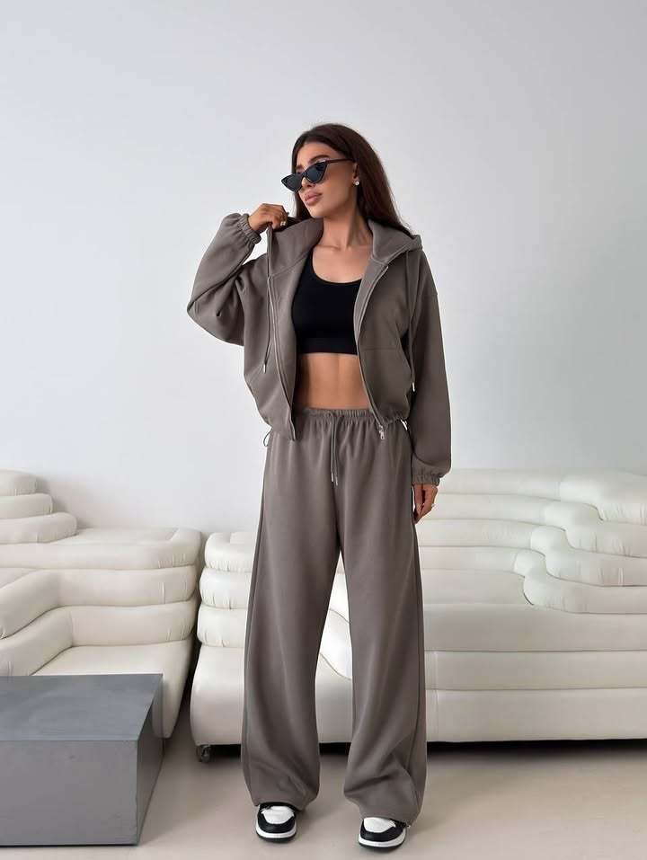 Fashionable women's hoodie with a short cut and matching jogger pants Chic and Style