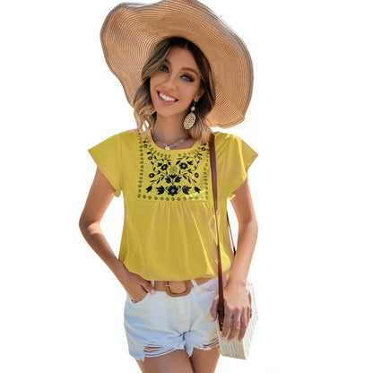 Chemisier femme avec des broderies florales et des accents saisissants Chic und Stil