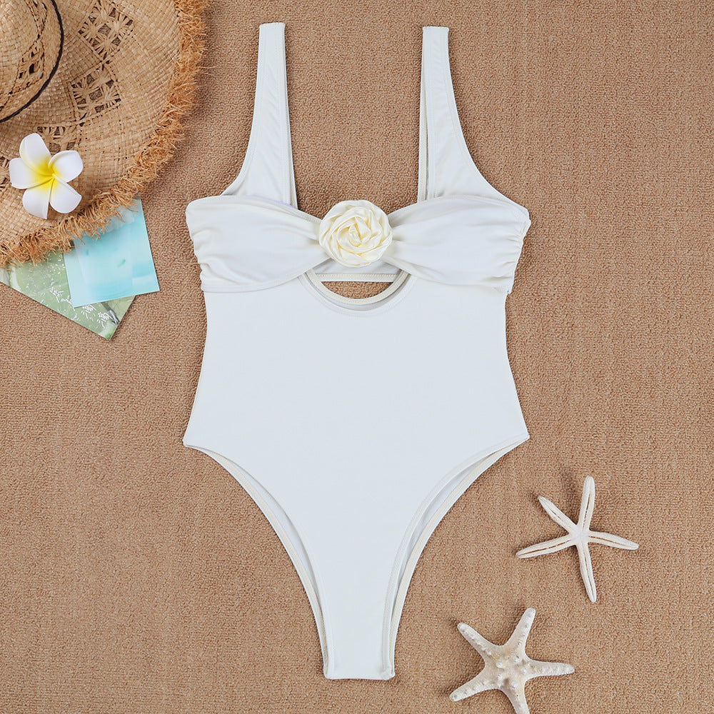 Ladies elegant one-piece swimsuit with floral accent and chic back neckline
