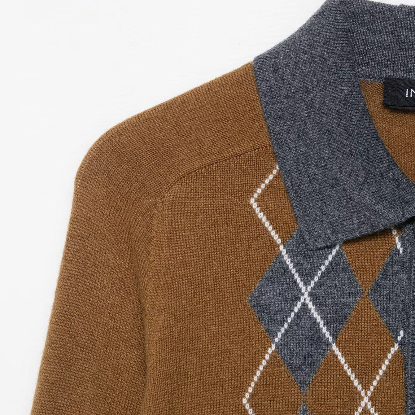 Pull femme avec un motif losange moderne et col polo Chic und Stil