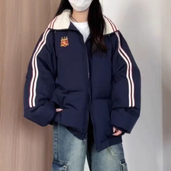 Dame Veste matelassée sportive avec des bandes contrastées et un col haut Chic und Stil