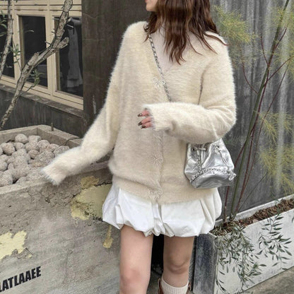 Dames Pull en maille pelucheux avec des détails de boutons élégants Chic und Stil