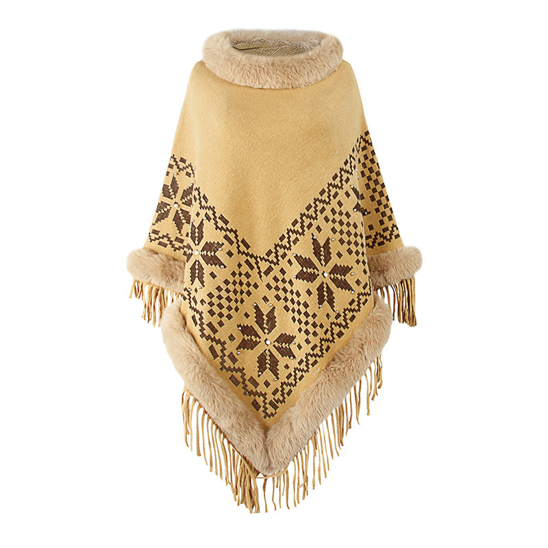 Elegant women's poncho with decorative fringe design and faux fur trim Chic and Style