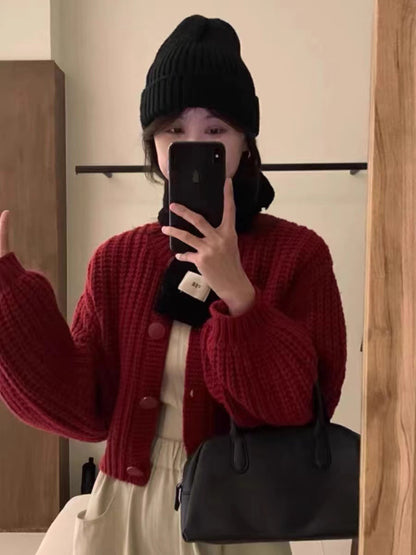 Cardigan en grosse maille pour femmes avec des manches volumineuses et de gros boutons Chic und Stil
