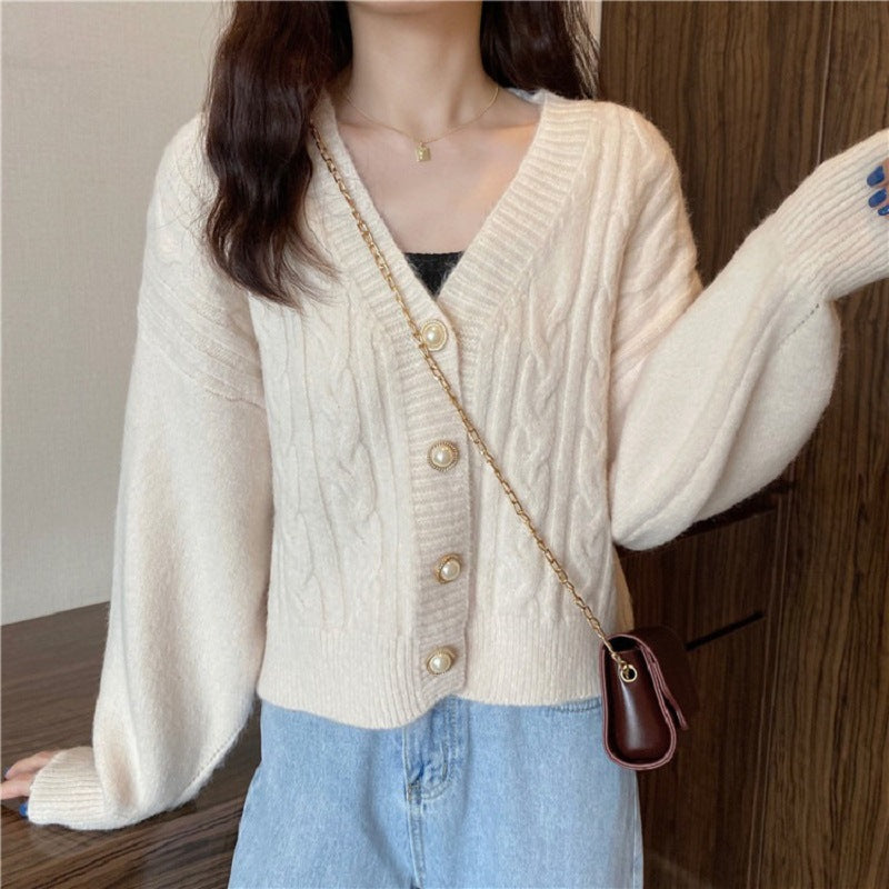 Knitted jacket for women with an elegant braid pattern and high-quality button details Chic and Style