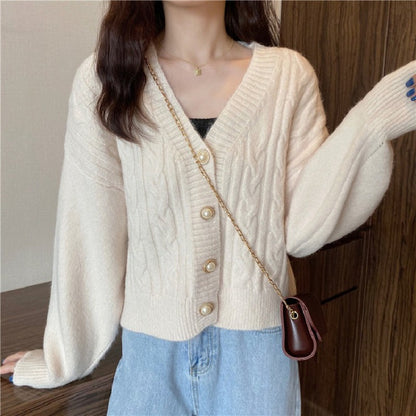 Knitted jacket for women with an elegant braid pattern and high-quality button details Chic and Style