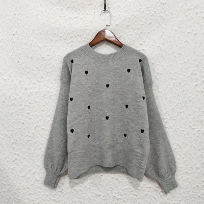 Pull femme avec un design de cœur ludique Chic und Stil