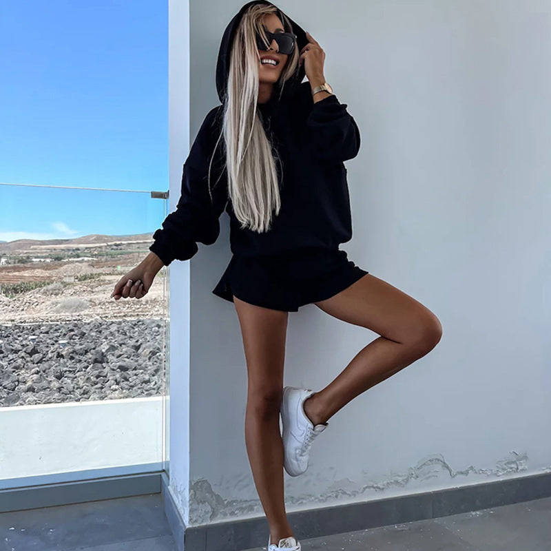 Fashionable women's set consisting of a comfortable hoodie and chic shorts