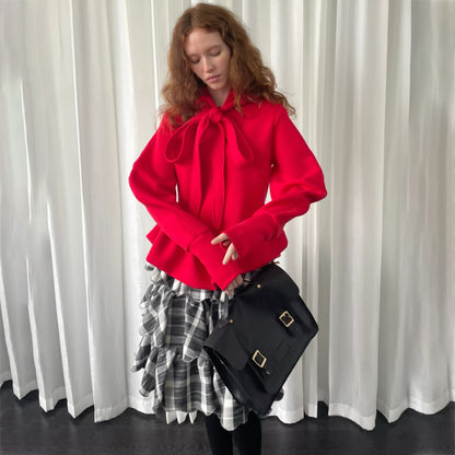 Pull femme avec détail de cravate et volants Chic und Stil