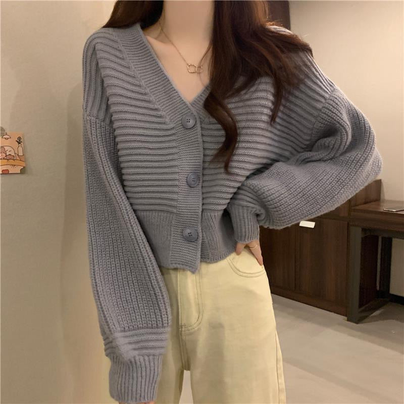 Cardigan en tricot confortable et élégant pour femmes avec des manches volumineuses et des détails de boutons Chic und Stil